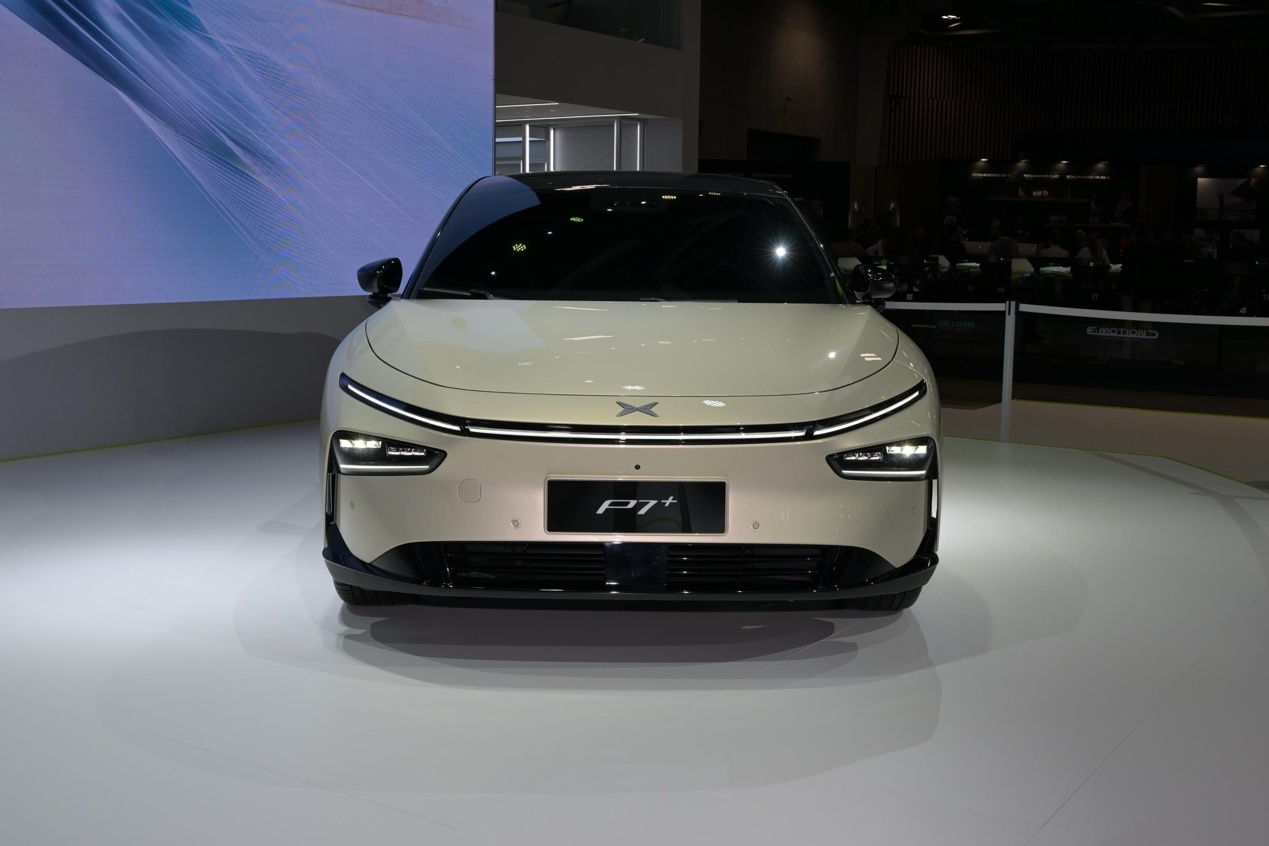 There is a silver sports car on the table.Medium confidence description has been generated automatically.