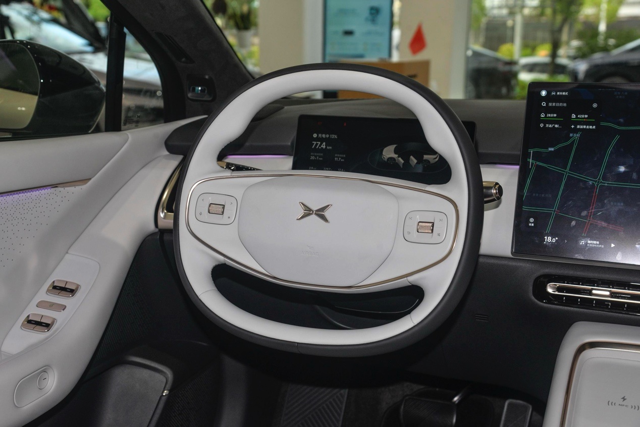 The steering wheel of a carDescription has been automatically generated.