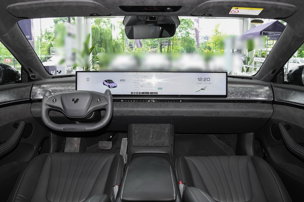 The steering wheel of a carDescription has been automatically generated.
